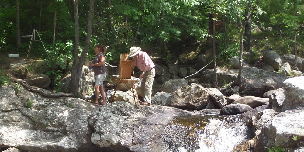 Plein air painting near a rushing Maine stream - Brush Cleaner for Painters and Other Painting Tips from The Brush Butler